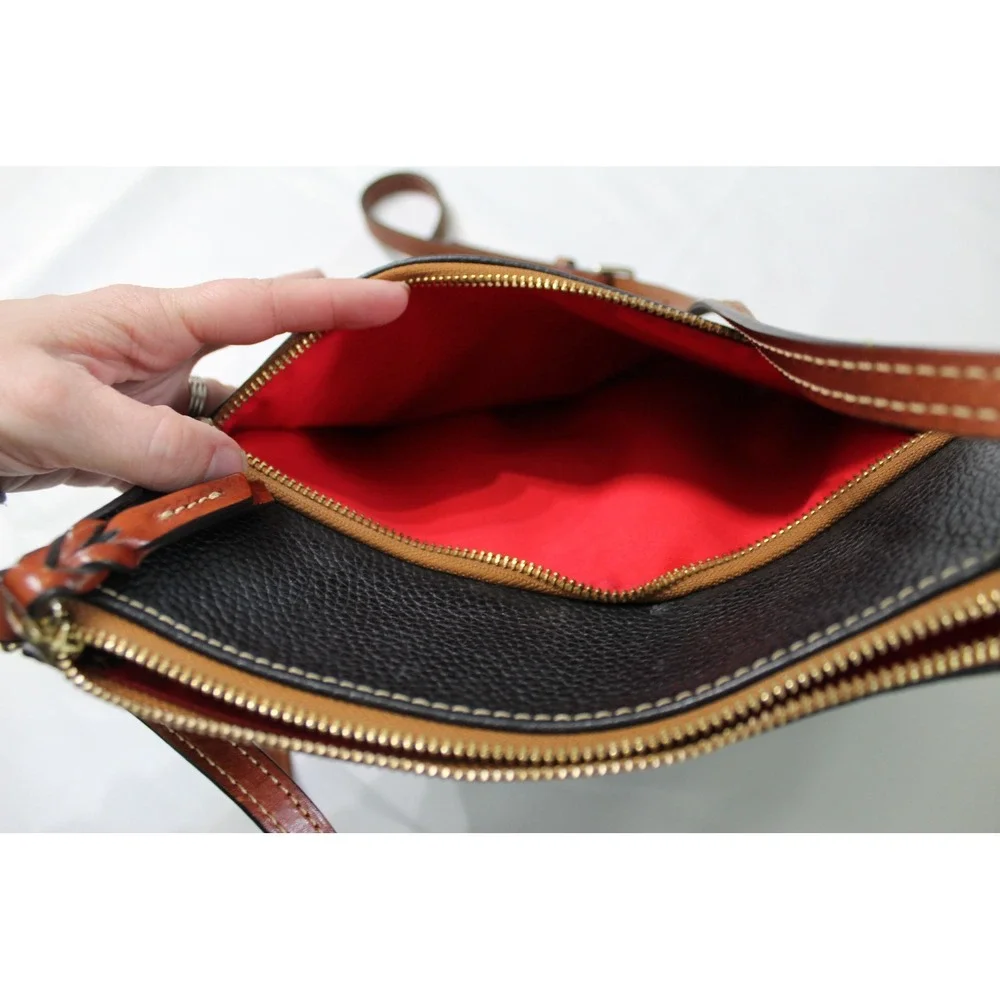 Dooney & Bourke Black Pebbled Leather Crossbody Bag with Tan Trim and Red Lining